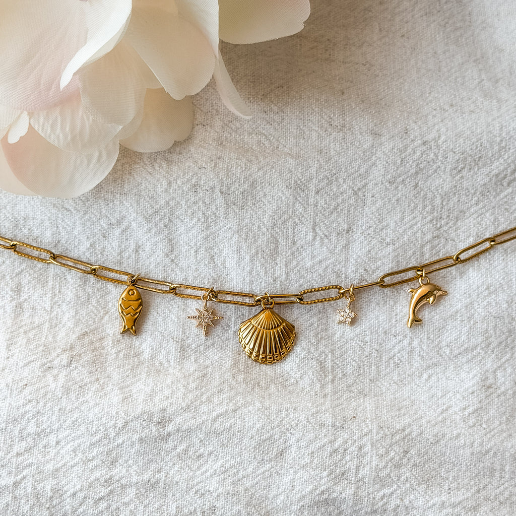 Vergoldete Marina Charm-Kette mit Muschel, Delfin, Fisch und Sternen