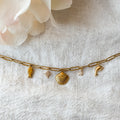 Vergoldete Marina Charm-Kette mit Muschel, Delfin, Fisch und Sternen