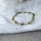 Elegantes Edelsteinarmband aus Aventurin mit goldenen Kleeblatt-Perlen als Glückssymbol